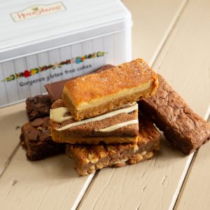 Selection of cake slices with a Honeybuns gift tin