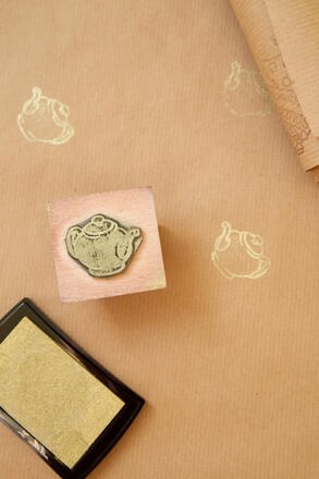 Small stamp with teapot design