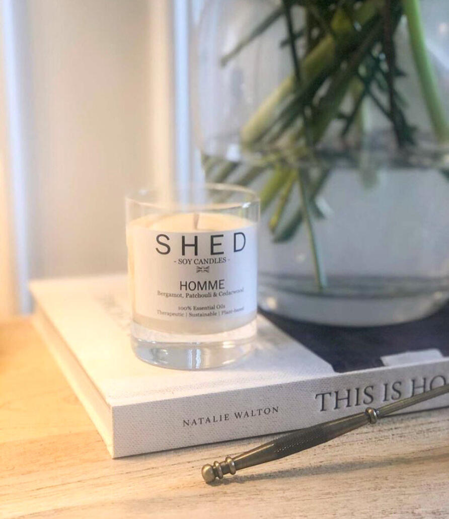 Shed Soy Candle on book