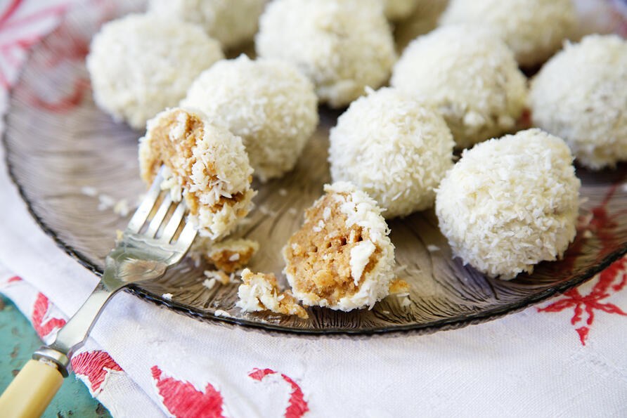 Gluten free Snowball Cake Truffles on glass plate with fork