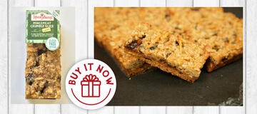 Mincemeat Crumble Slice cake slice in packaging and traybake on wood background