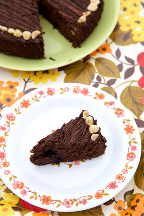 Gluten and dairy free Chocolate and Hazelnut Torte slice of cake on plate