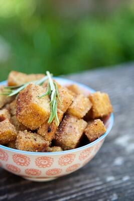 Crispy gluten free croutons with rosemary sprig