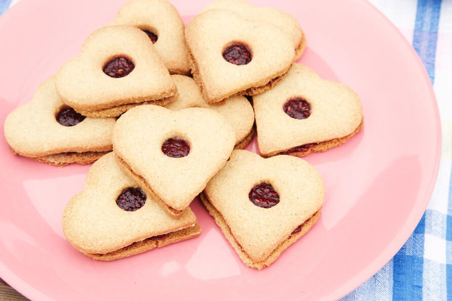 Gluten free heart shaped biscuits on pink plate
