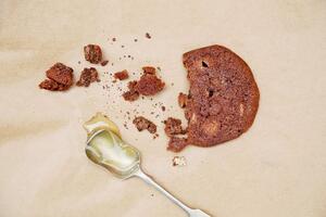 Gluten free Triple Chocolate Tinker cookie and honey spoon