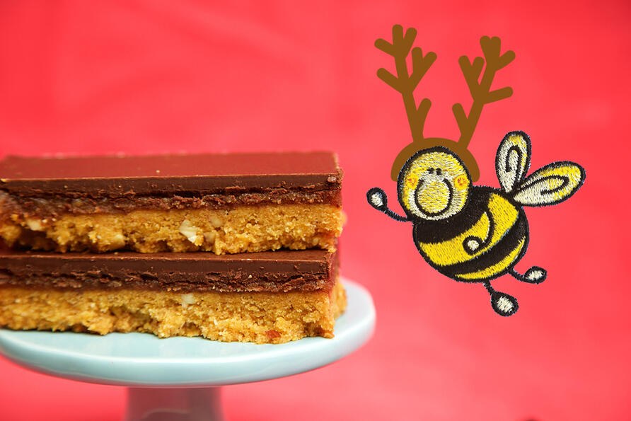 Stack of Millionaire's Shortbread on cake stand with christmas bee