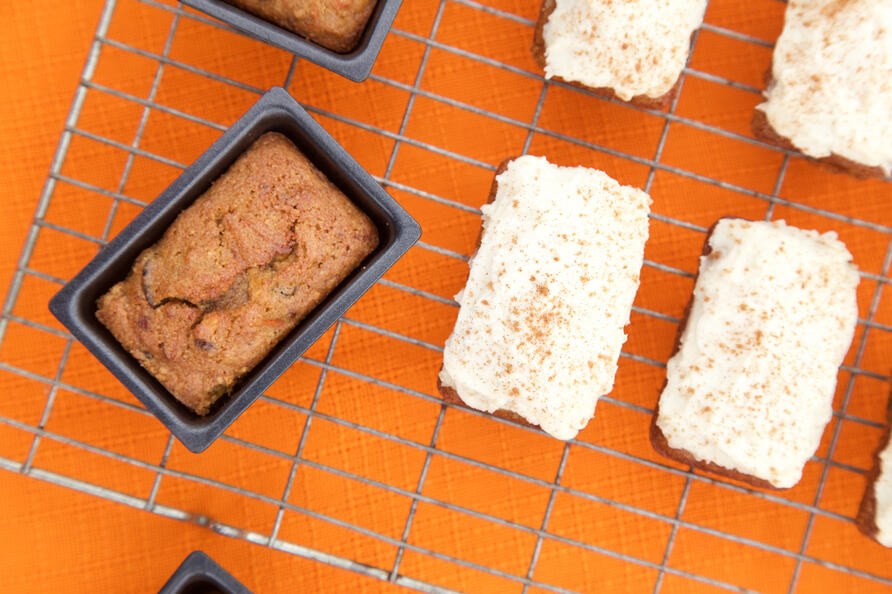 Mini gluten free carrot cakes on wire cooling rack