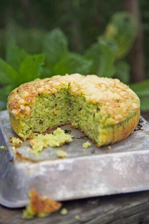 Green pea and mint tart with slice removed