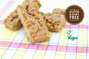 Honeybuns vegan Oaty Coconut Bar on tablecloth