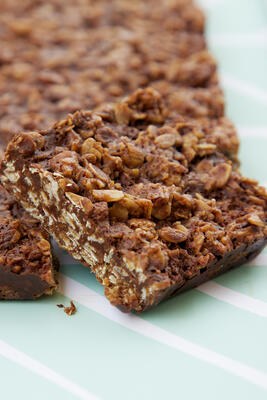 Stacked Oaty Coconut Bars with dark chocolate, a Free From Eating Out Award finalist
